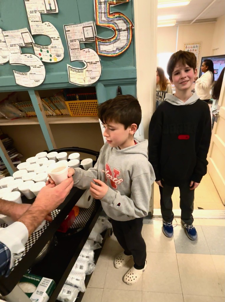 Two fifth graders about to enjoy some hot cocoa