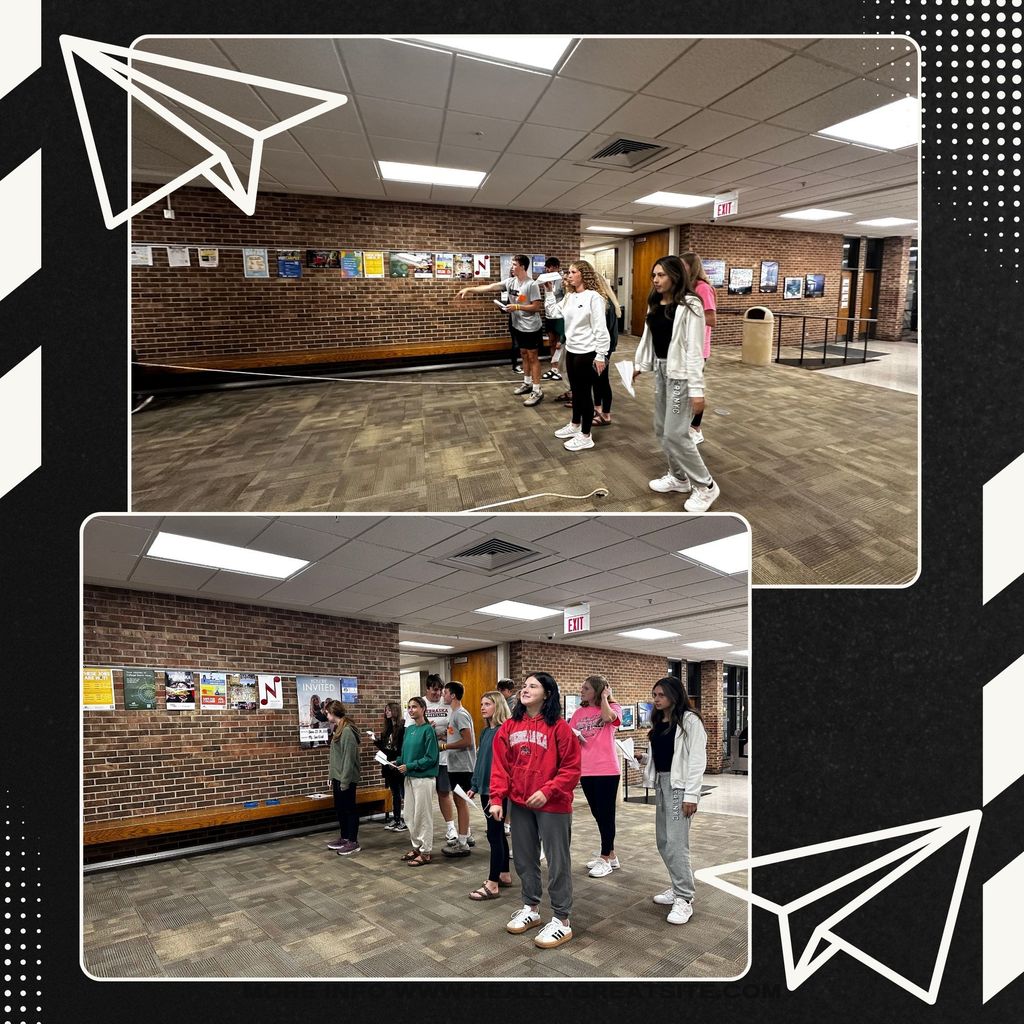 Stats students throwing and measuring their paper airplane throws.