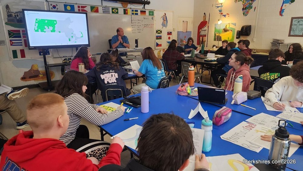 Social studies teacher Mark Karhan has students read out the letters they've composed on rural school aid that will be forwarded to the governor's office.
