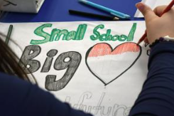 A poster reads, "Small School Big Heart."