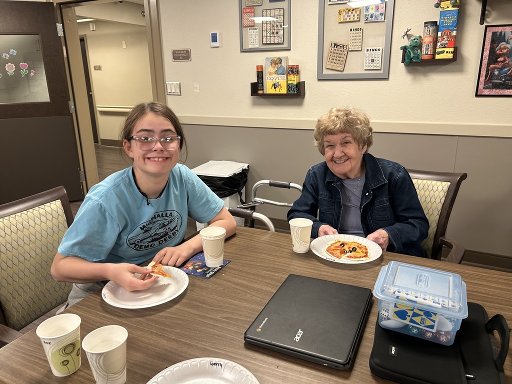 Kids and elders making pizza