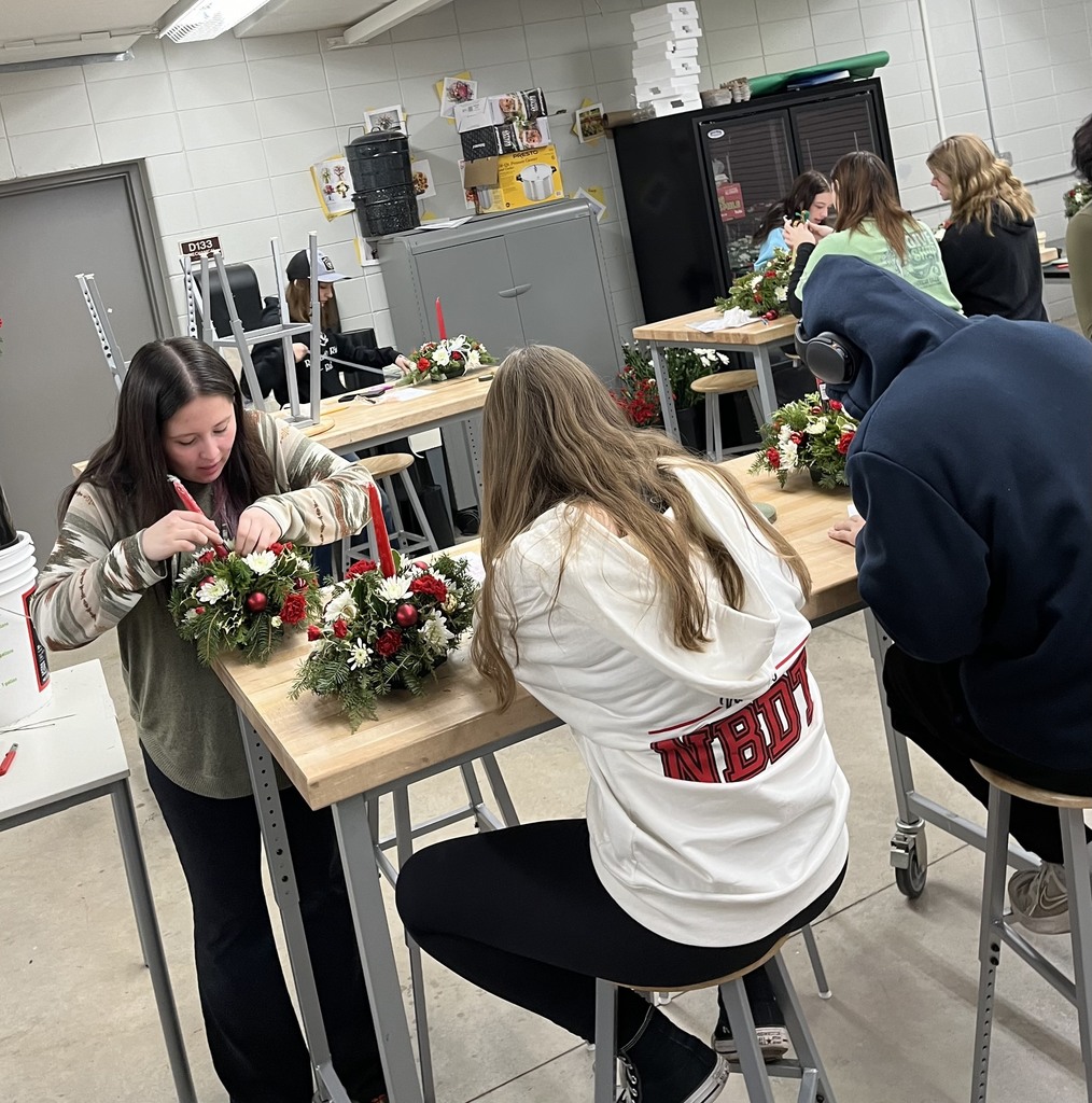 Students making floral arrangements