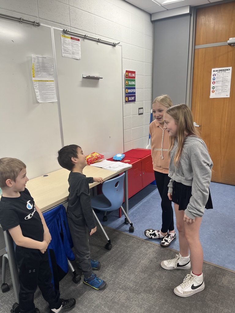 6th Grade Spanish students working with Kindergarten Spanish students