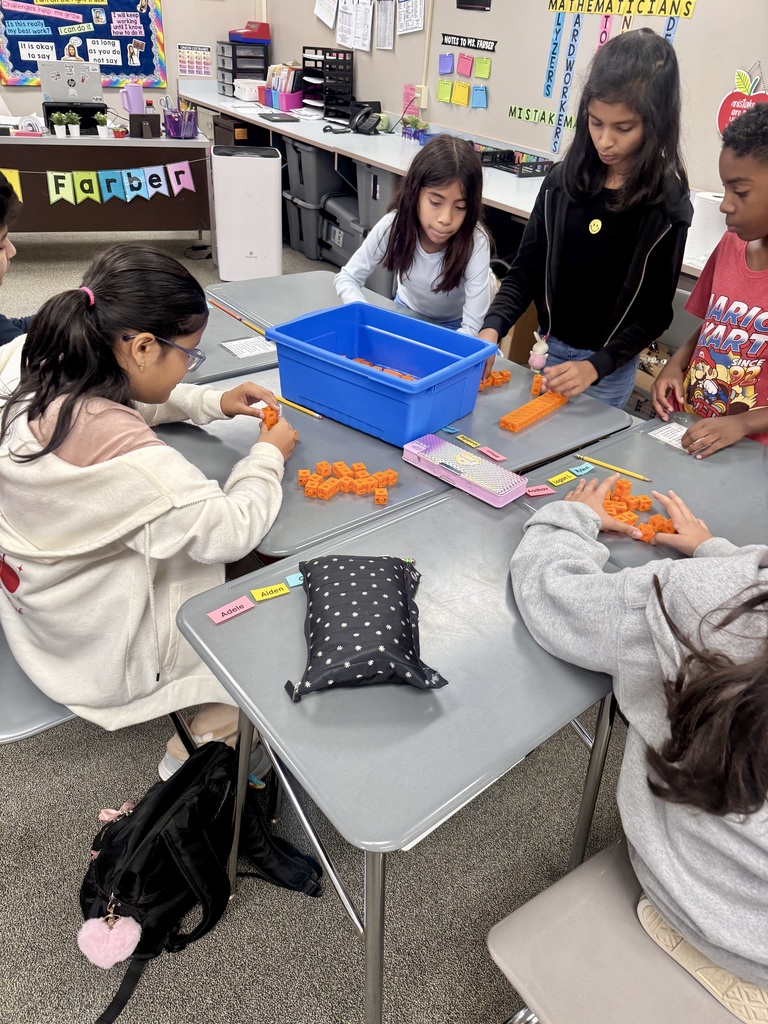 Students building rectangular prisms using unit cubes