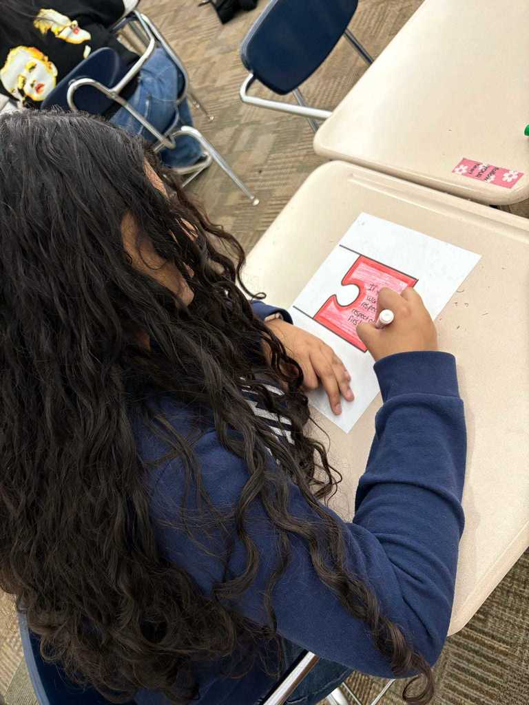 Students were tasked with defining or depicting what respect means and looks like to them. All of these puzzle pieces will be assembled to spell out the word respect. 
