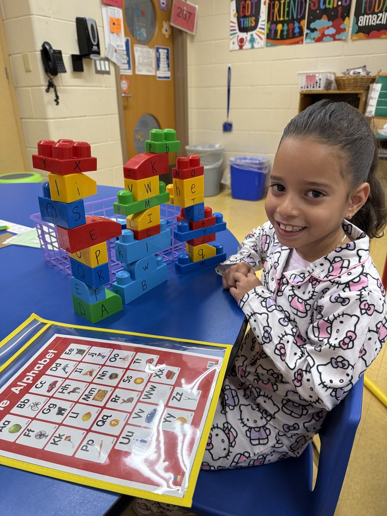 Building a tower of letters this morning!