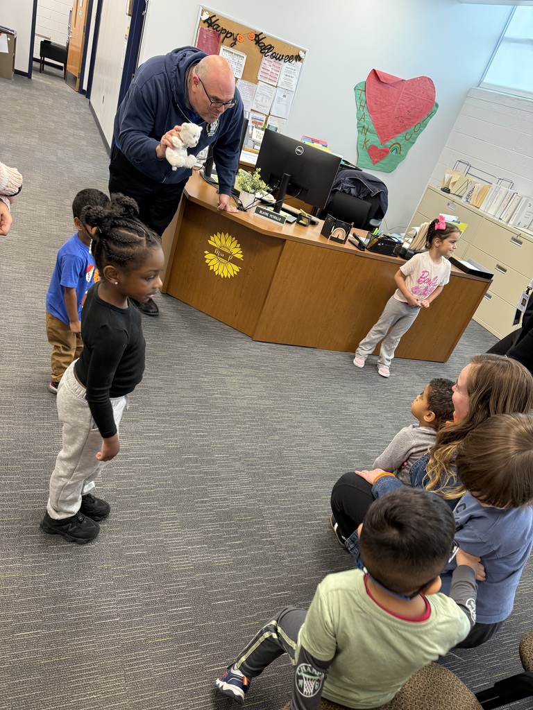 Preschool students visiting Mr. Passner and Officer Frank in the main office 