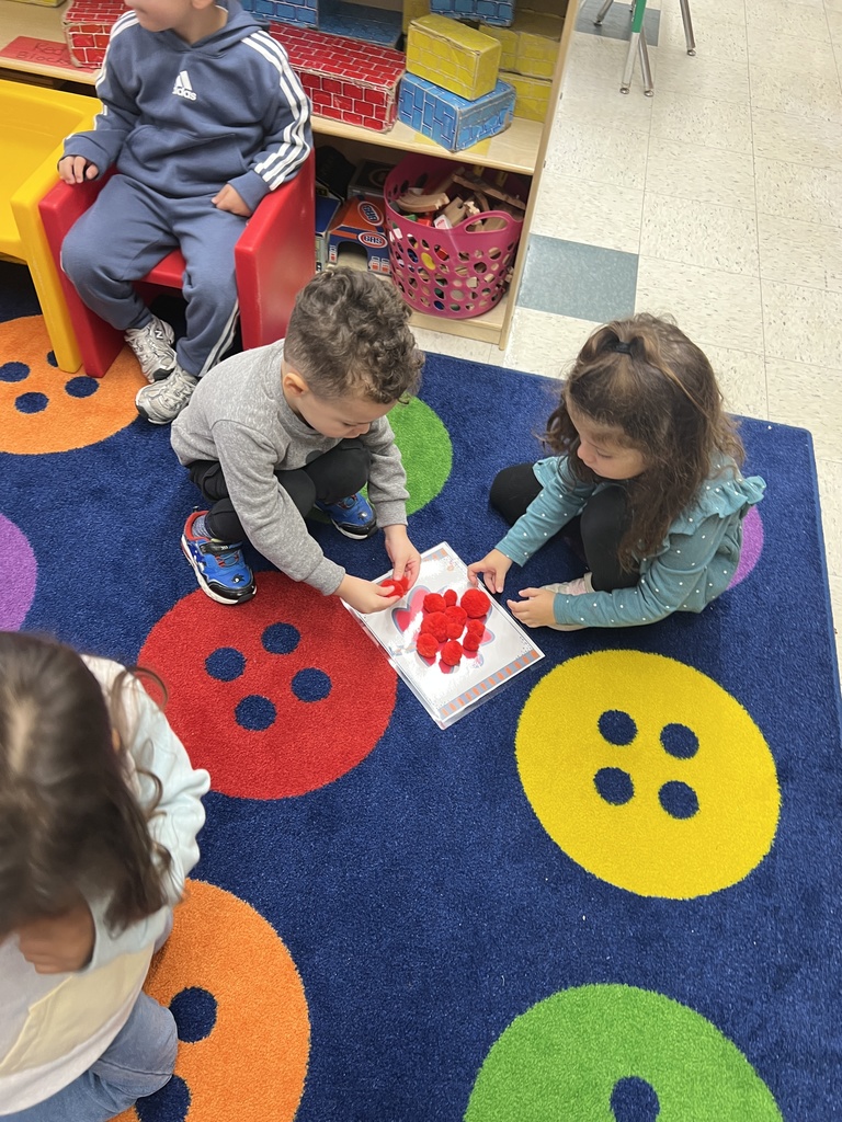 Judd Pre-K worked as a team to find the color matches for their pompoms, then predicted which color had the most