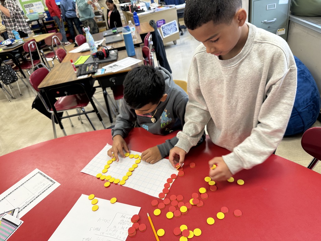 4th grade students solving a math problem.