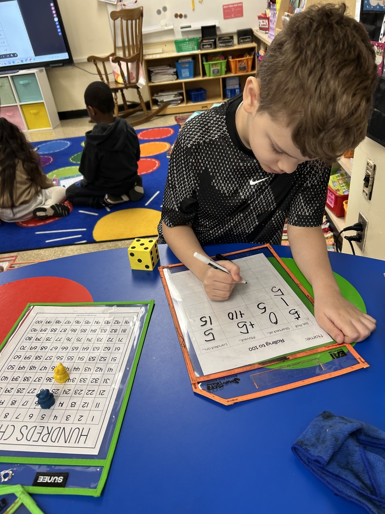 Students practicing addition games