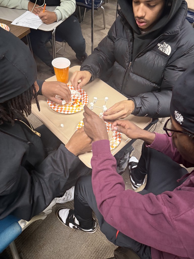 students working together to make a tower