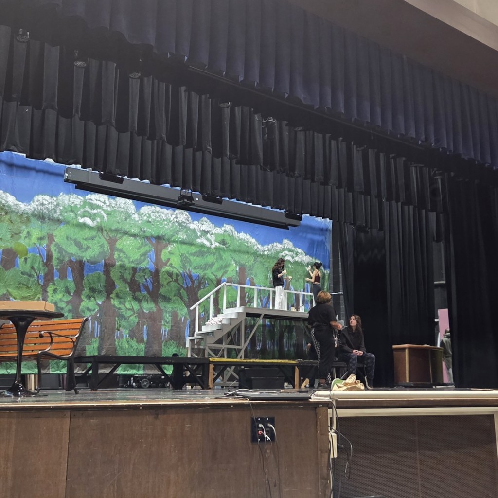 Kids on stage painting and acting