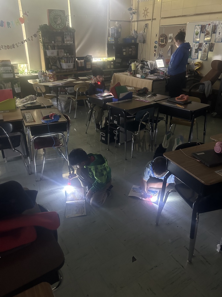 Second graders love independent reading with flashlights!