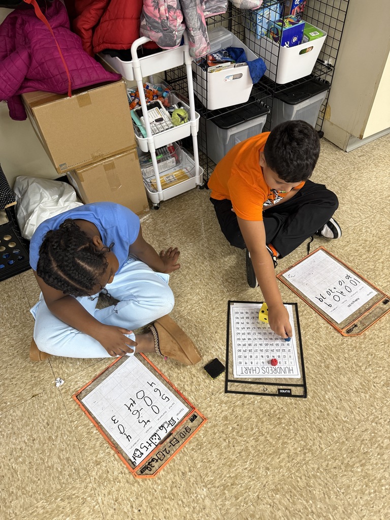 Second graders playing math games with another class!