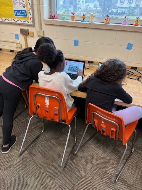 Third graders working on their parade video.