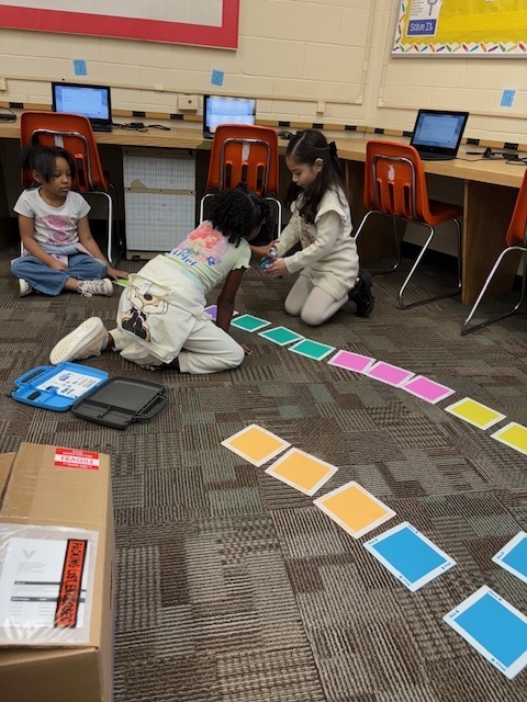 Students programing robotic cars 