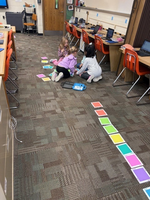 Students programing robotic cars 