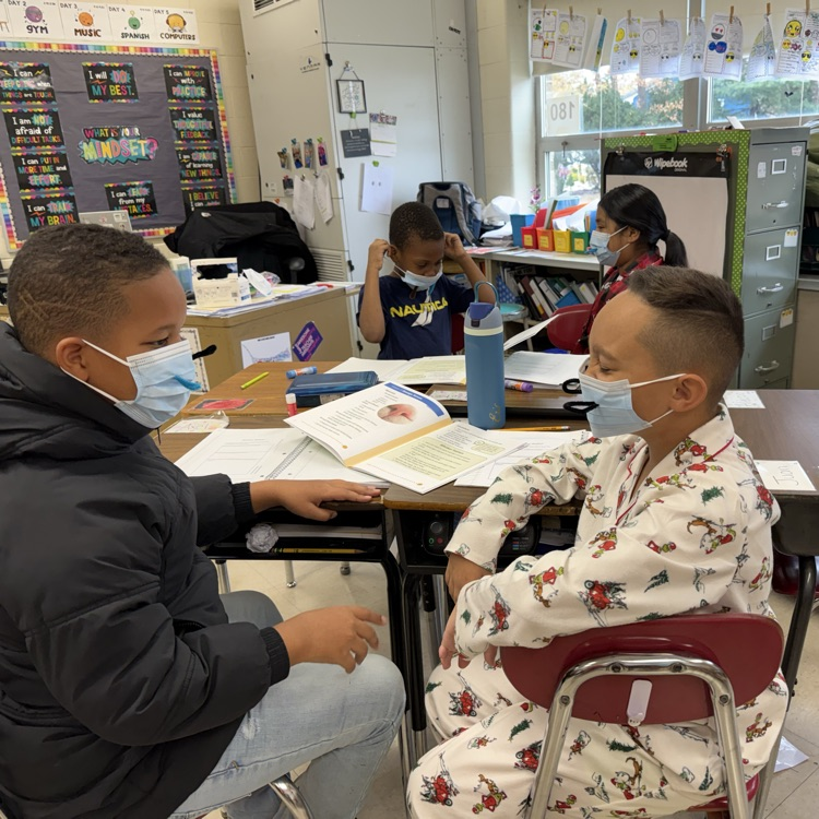 children with masks in a classroom