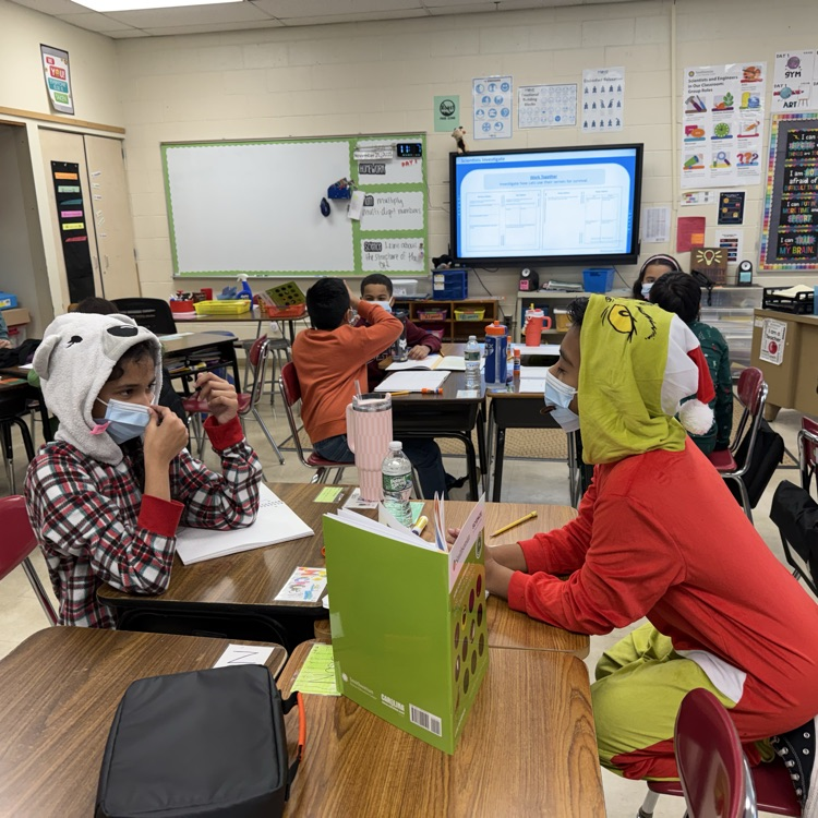 children with masks in a classroom