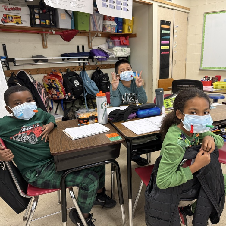 children with masks in a classroom