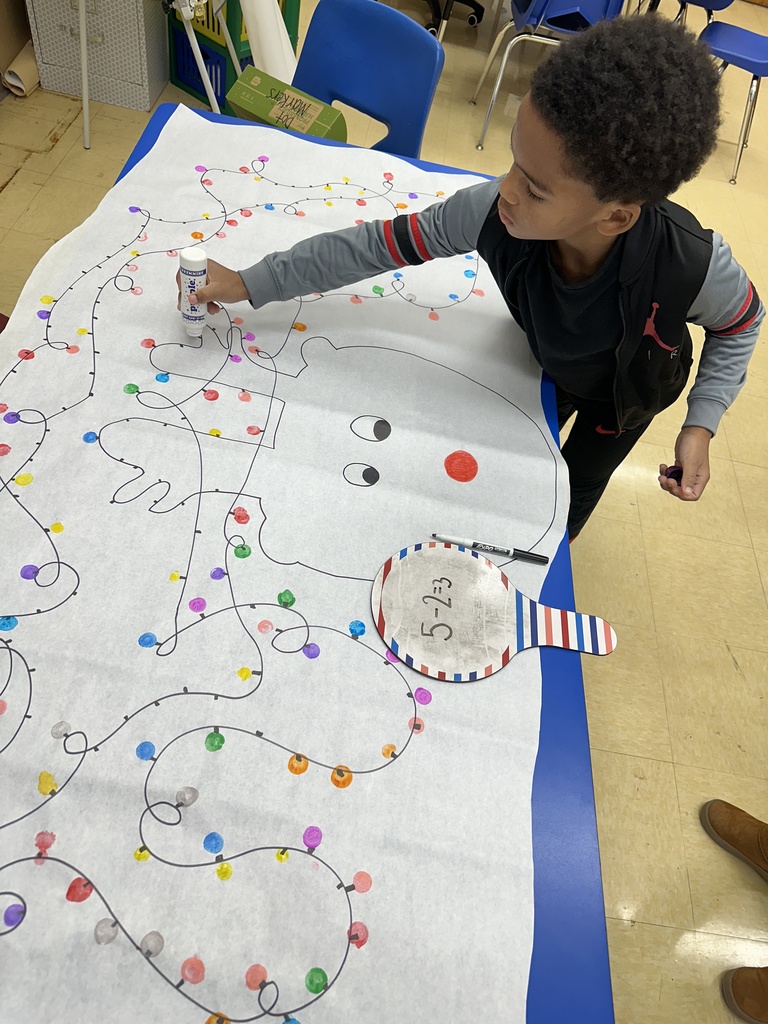 Students were subtracting and using the answer to dot festive lights on a reindeer to be displayed in our hallway.