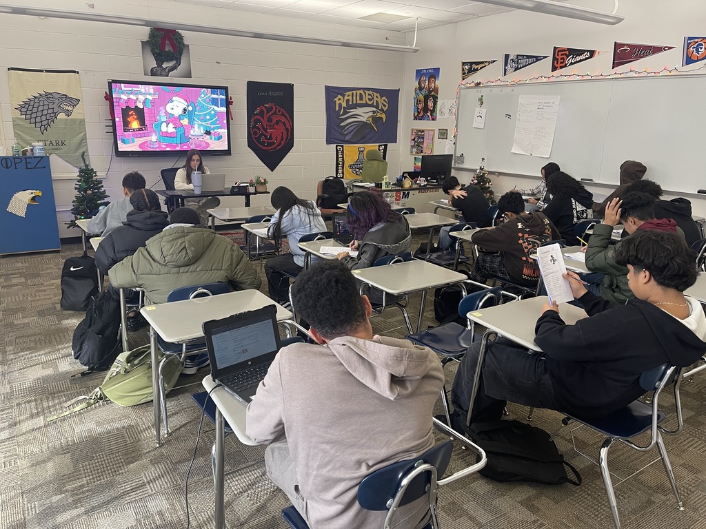 The students working through an activity. 