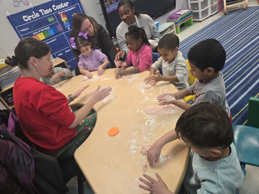 preschool students at a horseshoe table play with homemade peppermint playdough