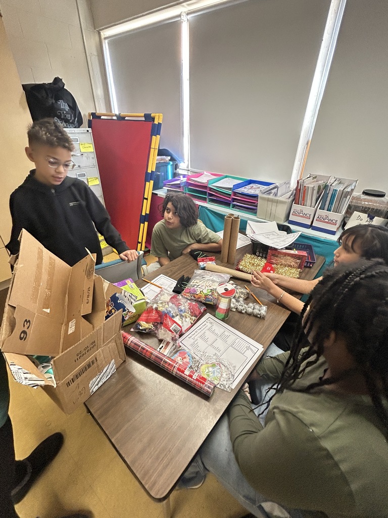 Students are talking and planning an Elf trap using different materials