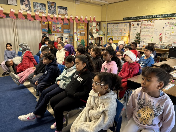 The children listen to Mr. Carter.