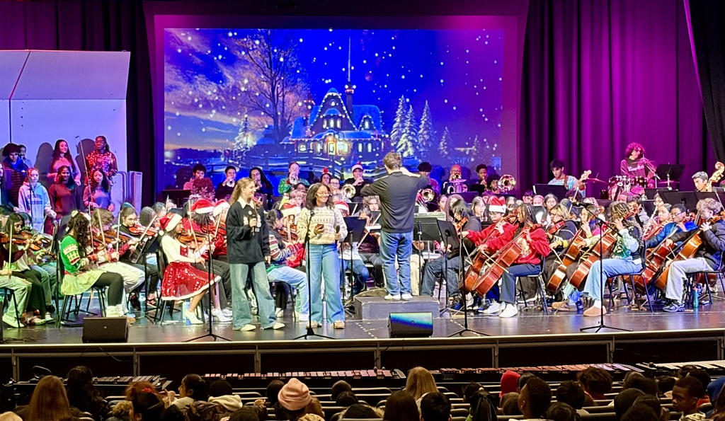 The NBTHS band delivers a preview of its Holiday Pops Concert to elementary students in the audience.