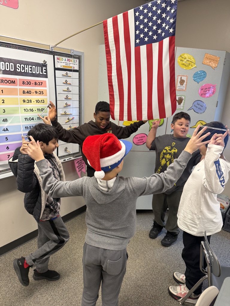 Students balancing pens in a team building activity