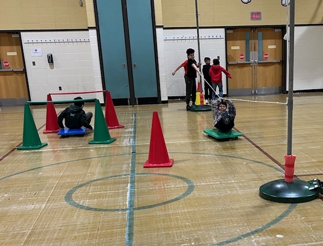 Using upper body and core strength to get up to the top of the mountain and sled back down.