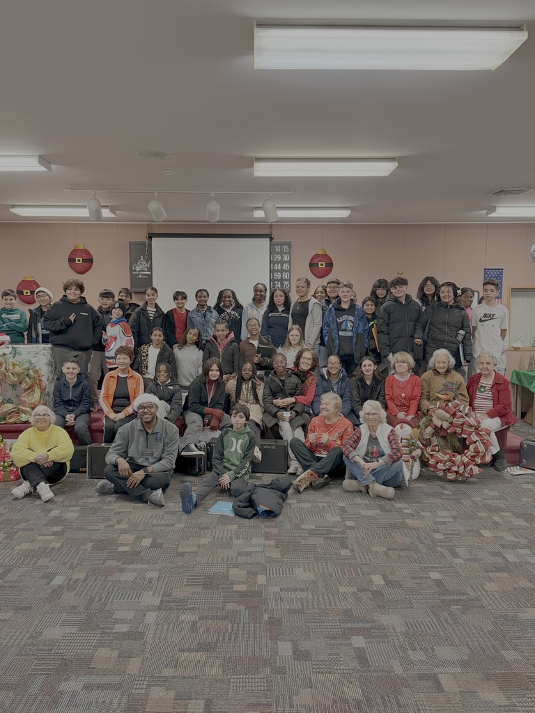 Linwood Band studentstaking a photo with the town's seniors.