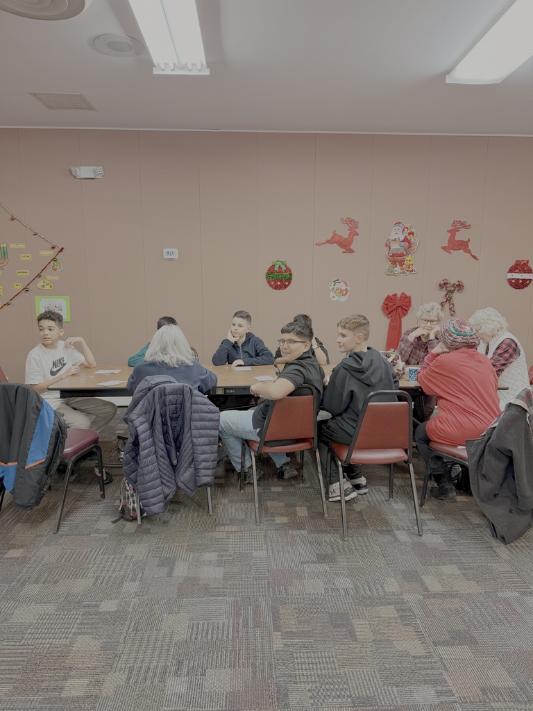 Linwood Band students and seniors playing bingo together.