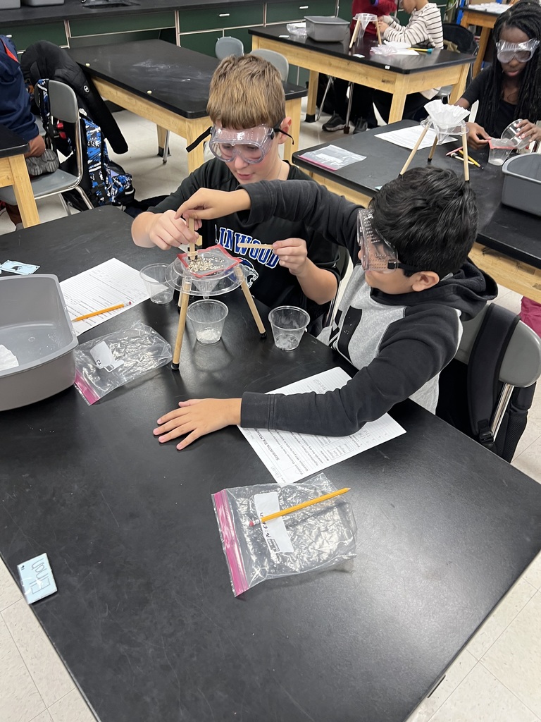 Using science tools to separate a mixture.