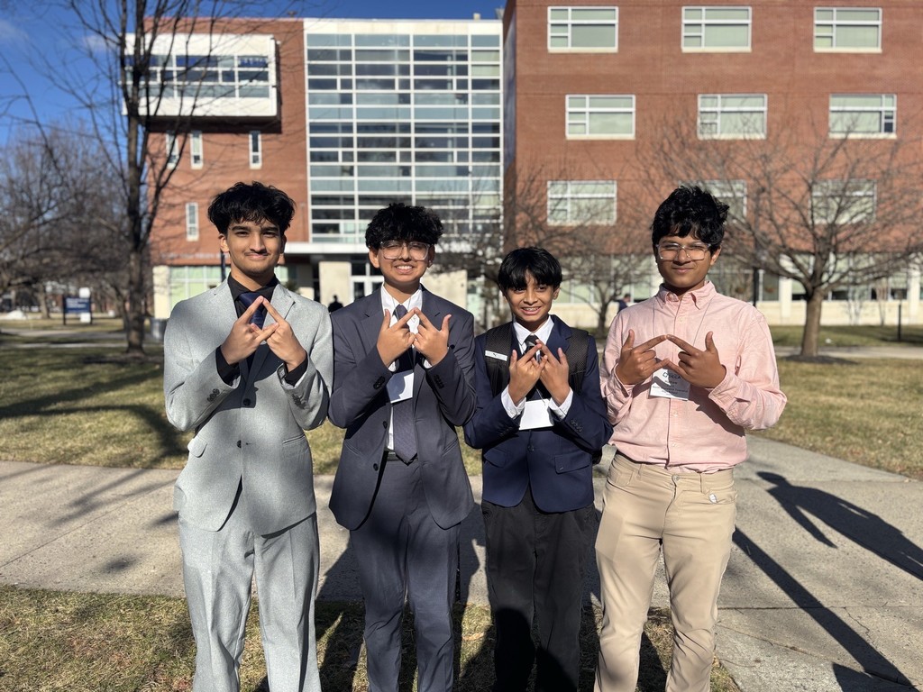 Students forming the DECA logo