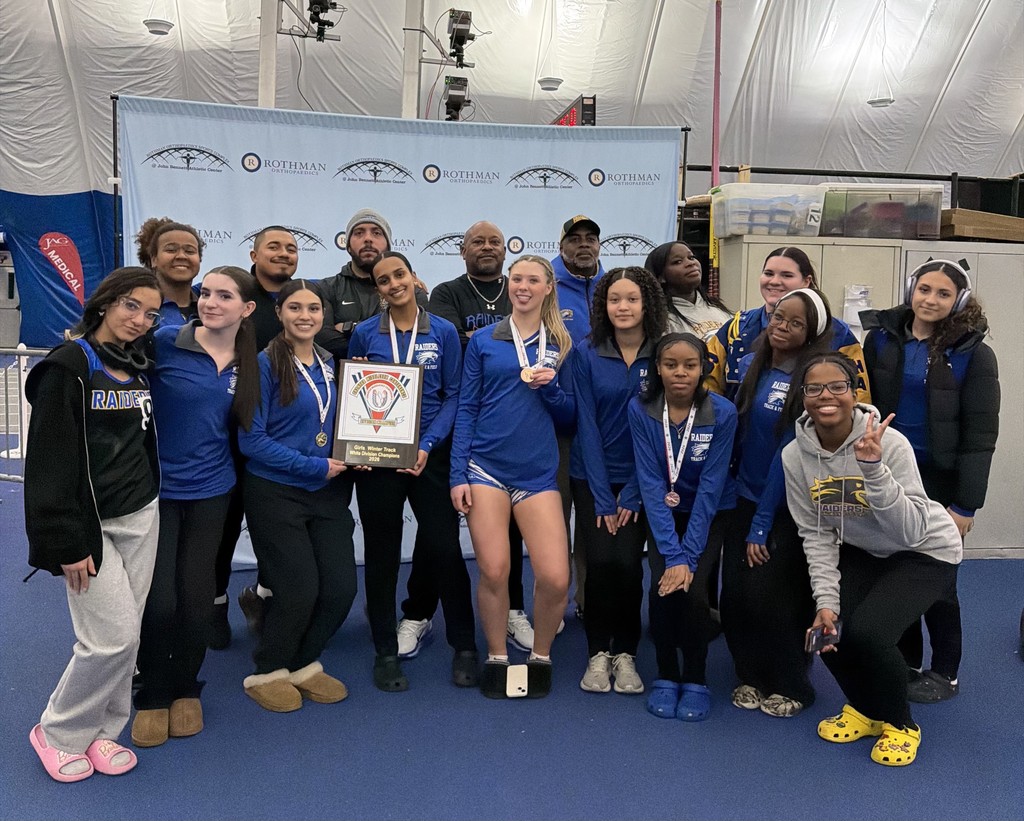 Division Champions - Girls Track team poses together