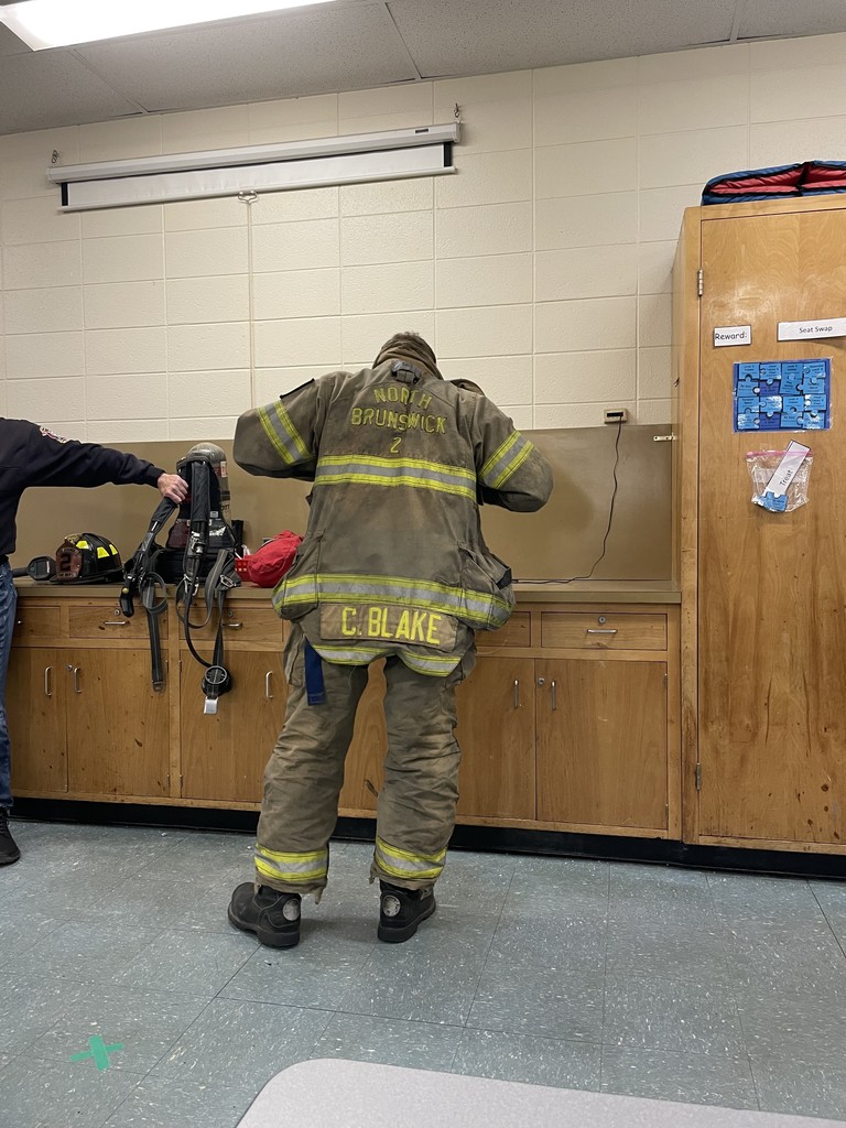 Firefighter showing off gear/clothing