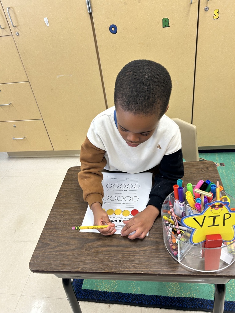 a student using 5 red and yellow counters to break apart the number 5