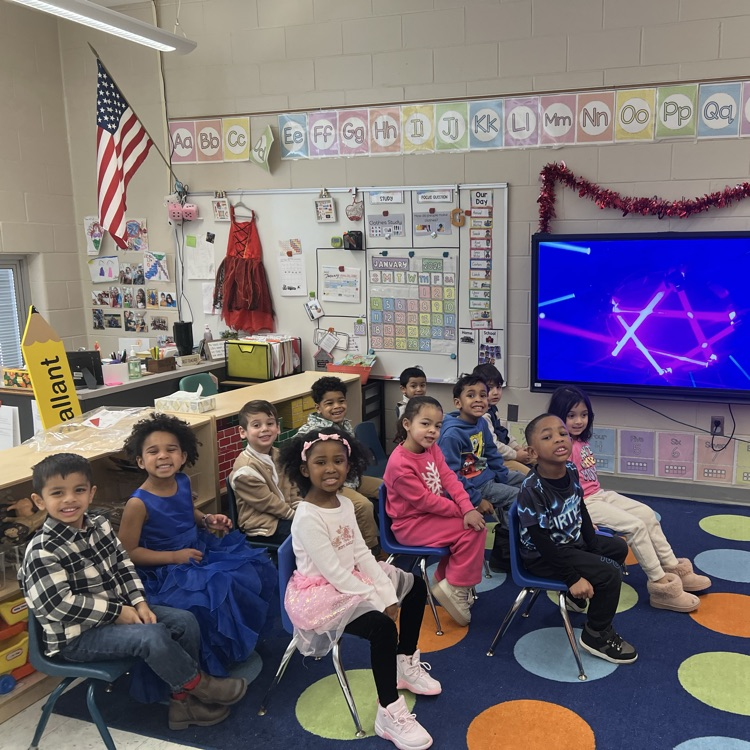 Group of students sitting in their classroom chairs.