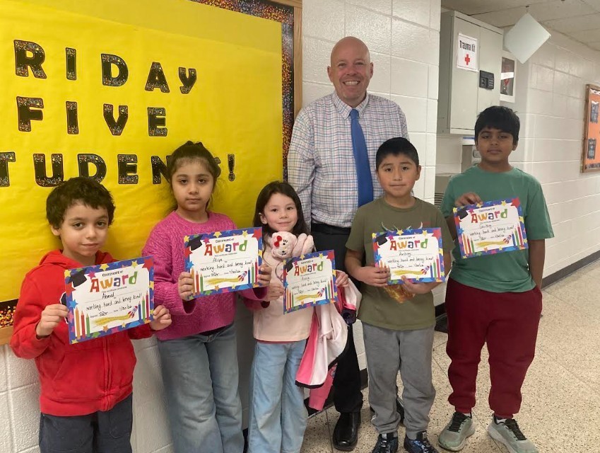 Group of students holding certificates saying Friday Five 1/30/26