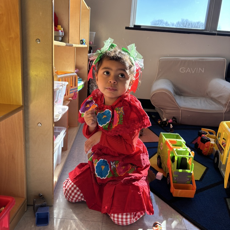 student sitting on floor