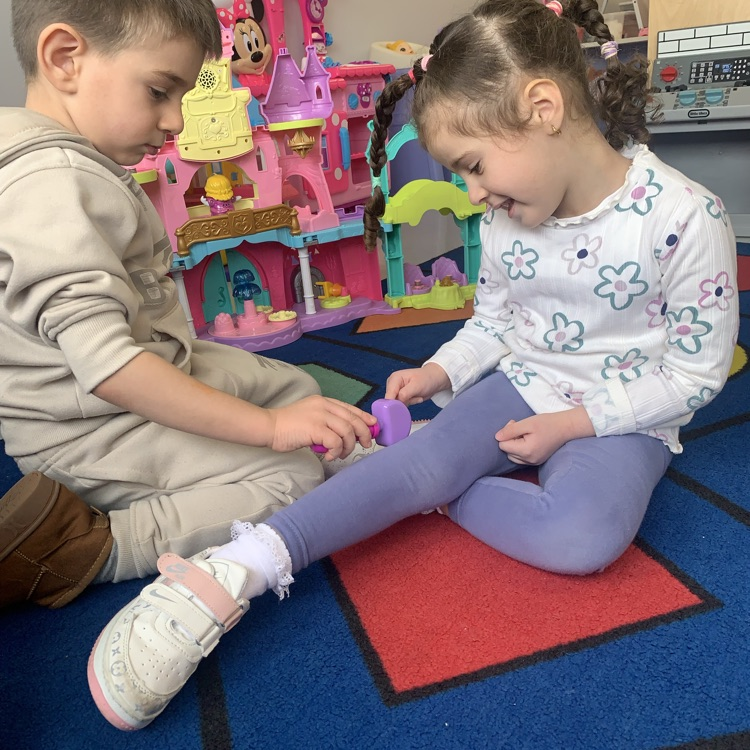 two students playing doctor together 