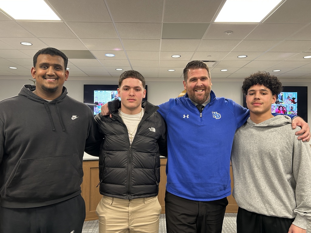 Student and teacher standing together