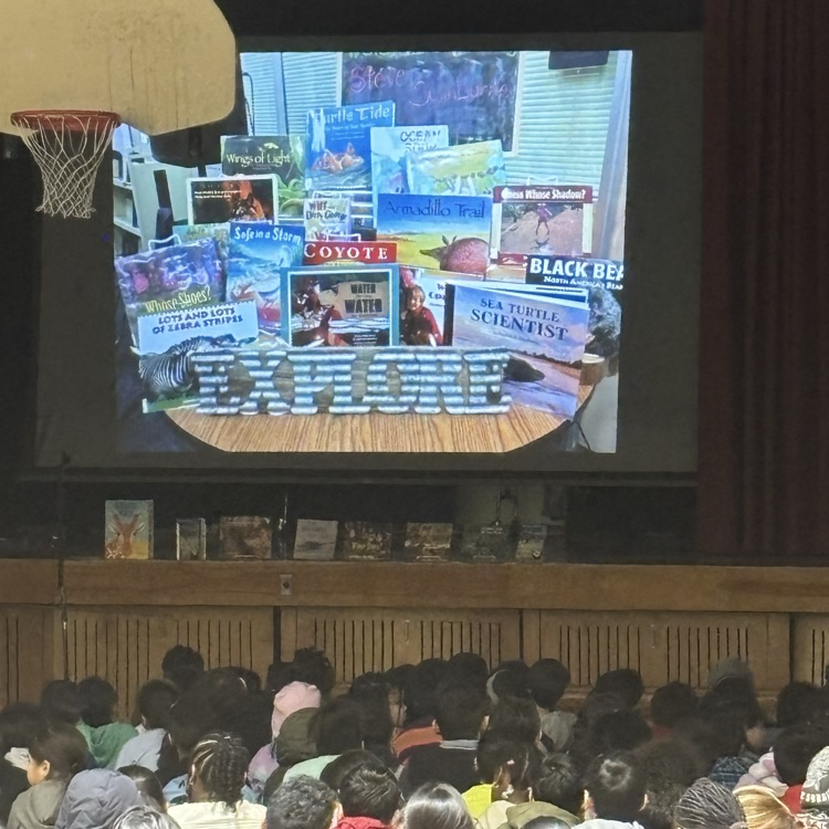 Slid of books with kids sitting on the floor 