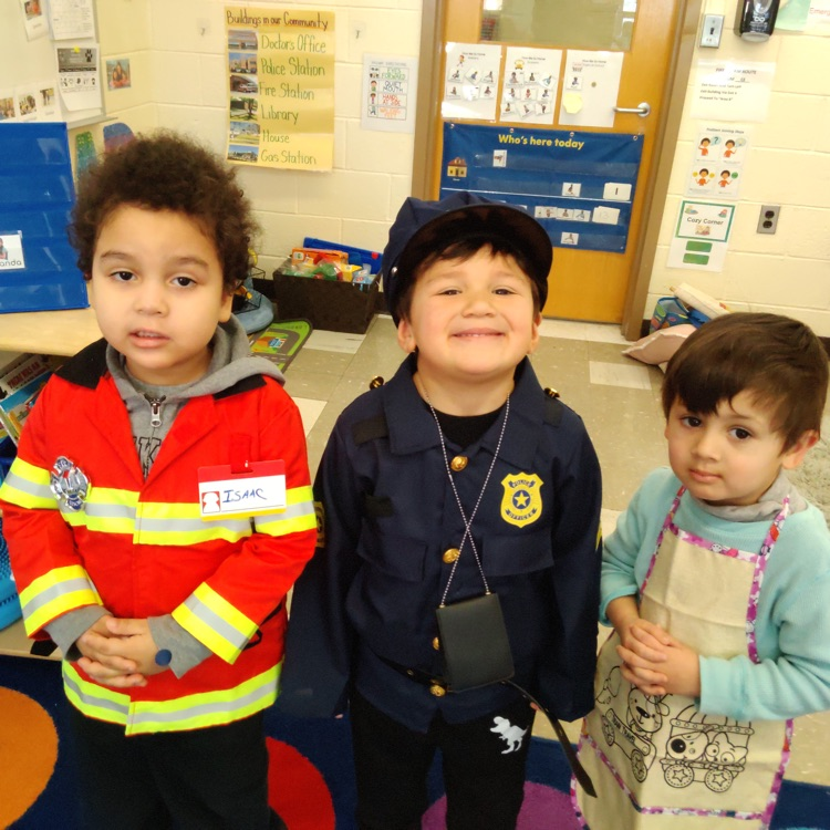 students dressed up as fireman, police officer, and chef