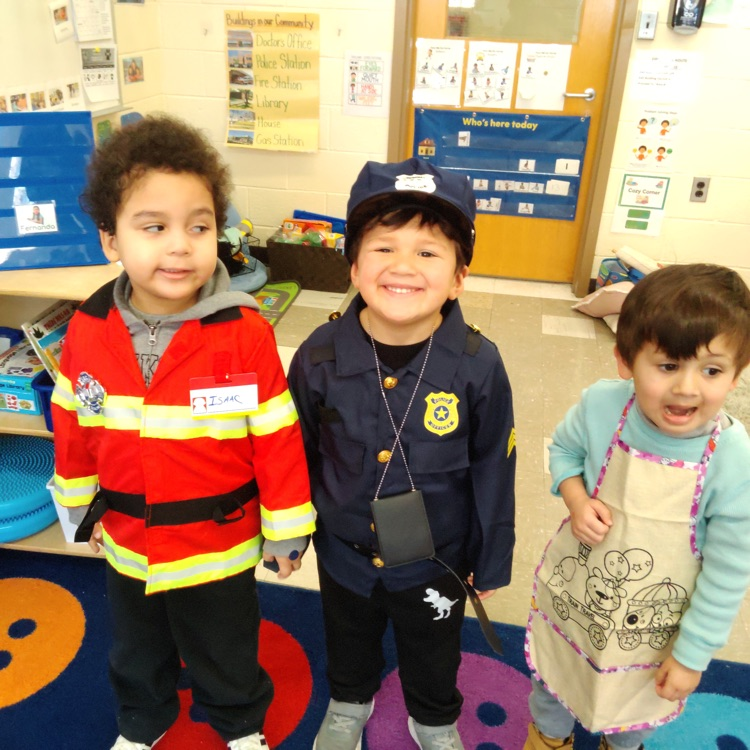 students dressed up as fireman, police officer, and chef