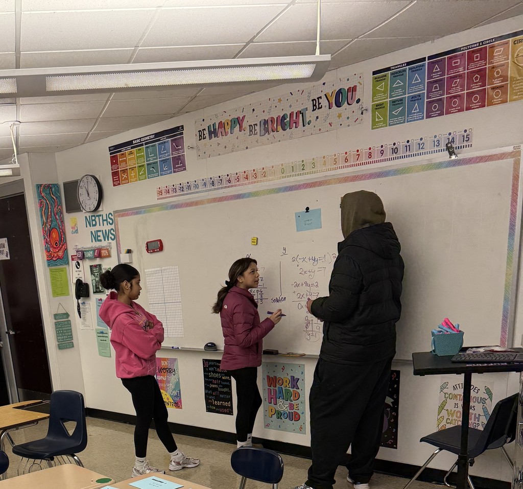 Students solving systems of equations