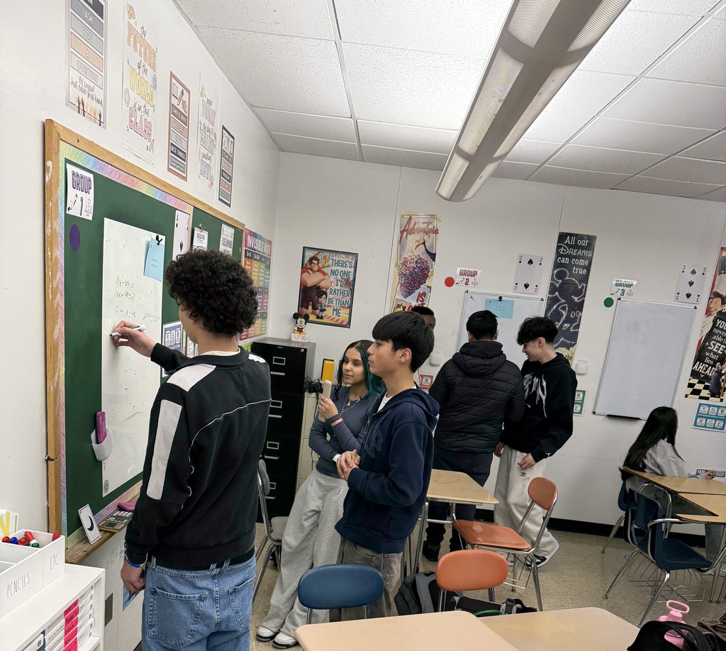 Students solving systems of equations