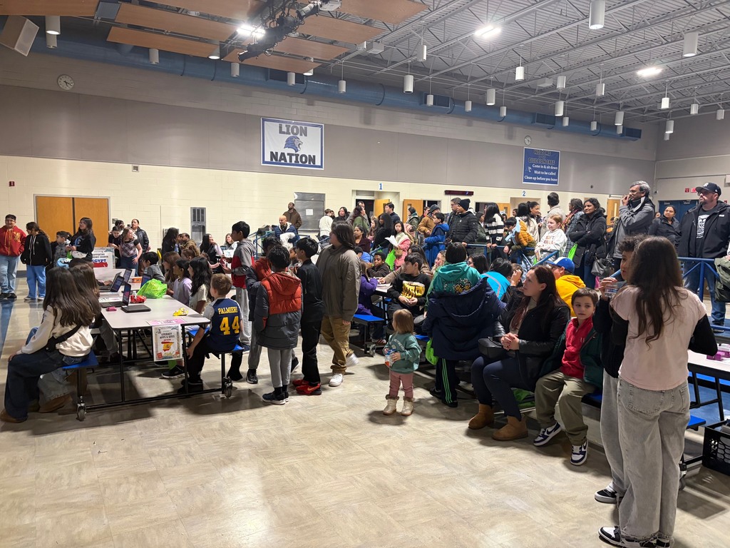 People walking around in a cafeteria